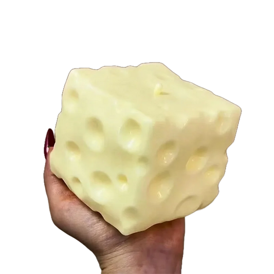 Jumbo Cheese Squish — oversized soft yellow cheese cube squishy held in a hand